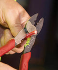 Person using USA Made Wire Cutter, Stripper, and Crimp Tool With Shear Cutter, Pro Grade for 10-22 AWG terminals and 10-18 AWG wires.