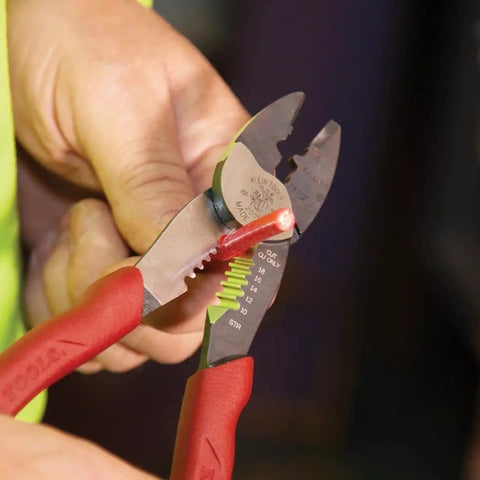 Person using USA Made Wire Cutter, Stripper, and Crimp Tool With Shear Cutter, Pro Grade for 10-22 AWG terminals and 10-18 AWG wires.