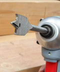 Spade drill bit, 3/8 in, hex shank, mounted in a handheld drill