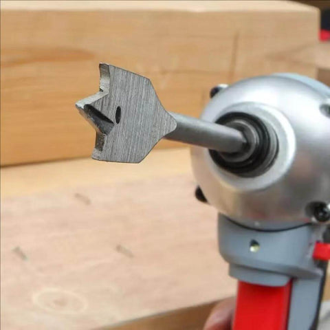 Spade drill bit, 3/8 in, hex shank, mounted in a handheld drill