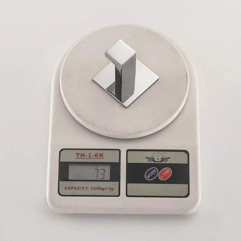 Square Coat Hook Set 2 Pack Stainless Steel Wall Mounted Self Adhesive on scale showing weight