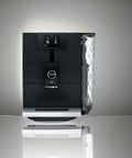 Smooth Operator Fully Automatic Coffee Machine Featuring A Smart Touchscreen And One Touch Milk Drinks In Polished Metropolitan Black, front view.