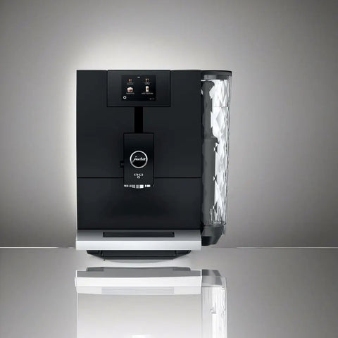 Smooth Operator Fully Automatic Coffee Machine Featuring A Smart Touchscreen And One Touch Milk Drinks In Polished Metropolitan Black, front view.