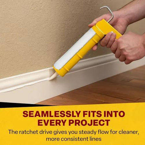 Dripless CR400 contractor caulk gun with yellow cradle applies white caulk along baseboard (29 oz cartridge).