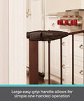 Stone Arch Auto Close Baby Gate For Doorways Bronze Metal Safety Gate with easy-grip handle in kitchen doorway