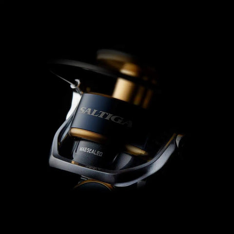 Close-up of Saltiga 18000H Spinning Reel 20 2020 Model For Saltwater Fishing With 66 Lb Max Drag, black background.