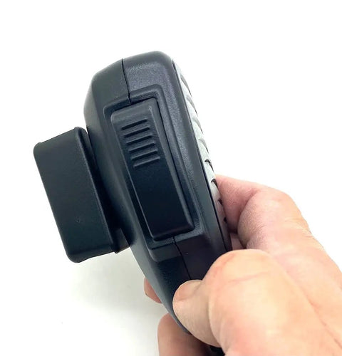 Hand holding Universal CB Radio Microphone Holder Mount with adhesive backing, pre-drill holes, T Tab clip, belt clip and round knob.