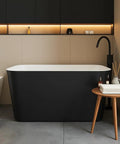 Premium Freestanding Acrylic Oval Soaking Bathtub 67 Inch Deep Soak Basin With Sleek Chrome Drain in modern bathroom setting.