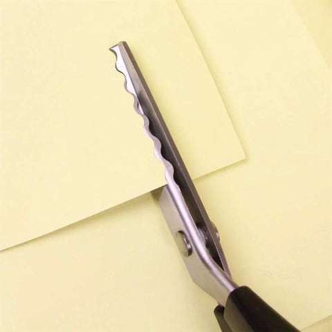 Pinking Shears For Fabrics Pro Grade Multi Purpose Stainless Steel Scissors With Black Handle 18mm Scalloped Serrated Blade For Fabrics Leather Linings Paper And Craft Projects, close-up on paper