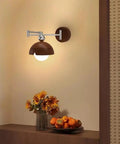 Swing Arm Wall Sconce, Modern Wood Lamp Bedside Reading Bedroom with dome shade and polished chrome arm, illuminating a warm space.