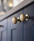 Set Of 12 Rustic Floral Antique Brass Cabinet Knobs For Kitchen Drawers on dark wooden cabinets