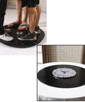 Heavy Duty 40 Inch Black Tempered GlassLazy Susan Turntable on floor with people standing, showcasing smooth rotation functionality.