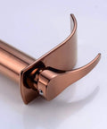 Rose gold waterfall single lever tap, sleek spout design, for modern vessel sinks, close-up view of smooth operation mixer