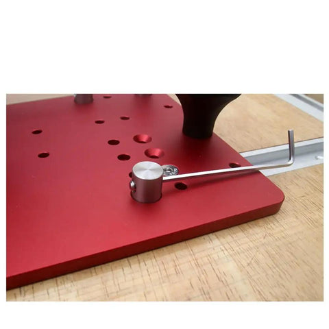 Close-up of a red Heavy Duty Router Table Rail Coping Sled For Cabinet Doors And Drawer Fronts Precision Alignment Tool with screws.