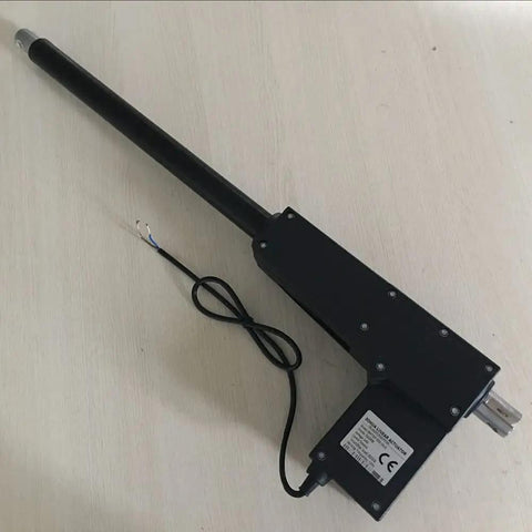 Heavy Duty 12V And 24V Linear Actuator With 20 Inch Stroke And 8000N Load, showing black push rod with wiring on wooden surface