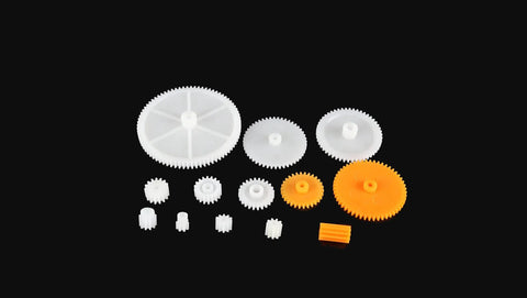 Awesome 200 Piece Plastic Gear Set for DIY Robots and Toys including various gears on black background