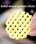 Crinkle-cut potato and vegetable slicer disc, round yellow plastic, handheld kitchen gadget