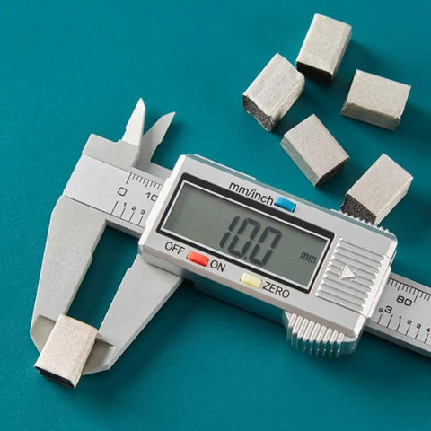 Conductive Foam Strip for EMI Shielding and Static Control, 10x10x5 Mm, displayed with caliper measurement, tough anti oxidation backing