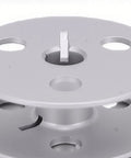 Close-up of Heavy Duty Four Hole Aluminum Bobbin With Cnc Machined Precision Balance for Durkopp industrial sewing.
