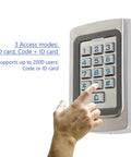 Hand using IP68 Waterproof Digital Wired Keypad in tough metal case for outdoor gates and garage doors 12V or 24V DC power