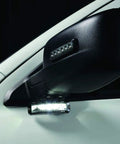 MicroPulse Wide Angle Perimeter Warning LED Light With 180 Degree Spread mounted on vehicle side mirror