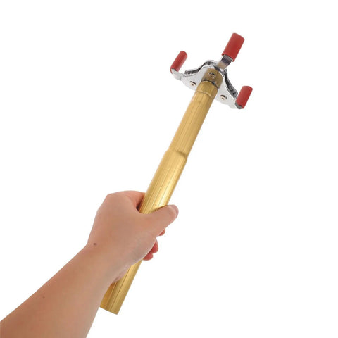 Slick Grip Smoke Sensor Removal Tool For High Ceilings Makes Replacement Dead Simple With Tough Aluminum Alloy Build, held by hand.