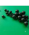 Twenty Piece Lot Of 1.588Mm Silicon Nitride Ceramic Balls G5 Grade on green surface, showcasing precision drop-in replacements for bike hubs.