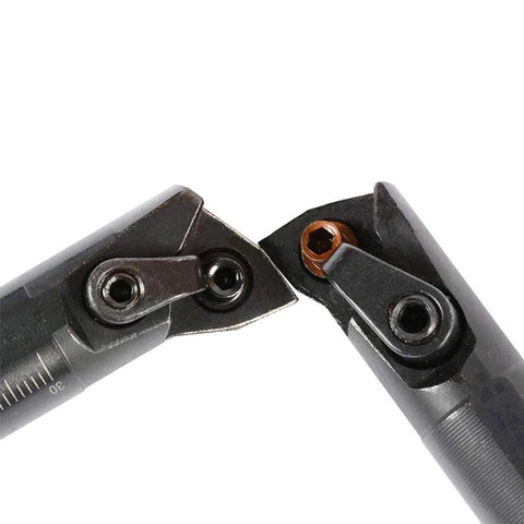 Two dark metal 5/8 in x 7 in indexable turning boring bars with orange carbide inserts for metal lathe turning.