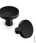 Close-up of 15 Pack Matte Black Cabinet Knobs 1.27 Inch Round Drawer Pulls for Kitchen Cabinets with screws included.