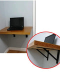 Heavy Duty Wall Mounted Shelf Brackets With Bullet Proof Triangular Steel Frame For Countertops And Floating Shelves Rust Resistant Matte Black Finish Hella Sturdy 800 Pound Load Rating Pair holding wooden shelf with laptop