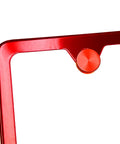 Close-up of red aluminum cap from Badass Stainless Steel License Plate Screws With Twist On Red Caps for all weather protection.