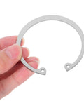 Five Piece Stainless Steel C Clips Kit For Grooved Shafts Heavy Duty Retaining Snap Rings Set With Multiple Sizes For Everyday Pro Grade Use And Quick Secure Fit being held.