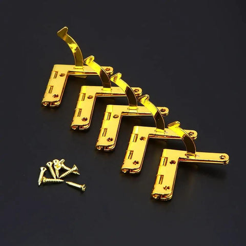 Rock Sturdy Cabinet Hinges 5 Pack Antique Brass 90 Degree Spring Assist Pivot Clamps with screws on black background.