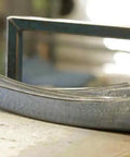 Beast Hand Forged Austrian Scythe Blade for Harvest and Yardwork, 33.5 Inch Length, showcasing two curved blades on a table