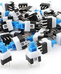 80 Piece DPDT Self Locking 6 Pin Micro Push Button Switch Set, Power Latching Buttons, scattered view of switches