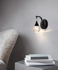 Crystal Bubble Wall Sconce With Dimmable LED 5W, 3300K Warm White, Matte Black Finish in living room setting