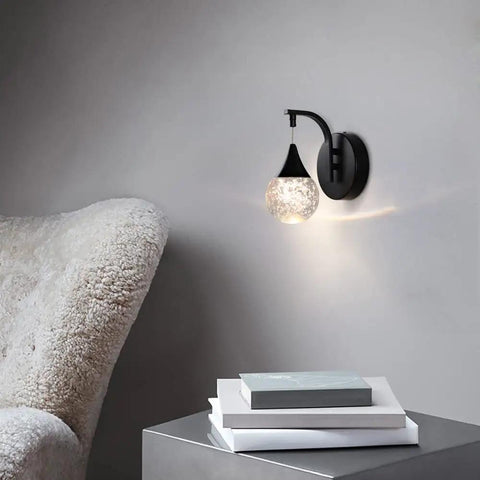 Crystal Bubble Wall Sconce With Dimmable LED 5W, 3300K Warm White, Matte Black Finish in living room setting