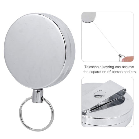 Close-up of metal retractable key ring wire keychain with belt clip anti theft anti lost design 5 cm diameter electroplated gear.
