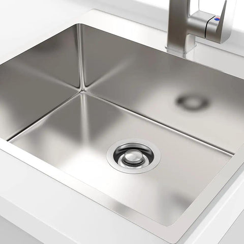 Top view of a kitchen sink with brushed stainless steel sink flange and stopper universal three and a half inch drain fit for garbage disposal.