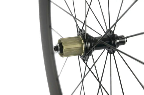 Close-up of Carbon 700c Clincher Wheelset For Road Bikes, 23mm Rim Width, Shimano 8 9 10 11 Compatible, hub and spoke detail.