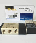 Front view of One Quarter Inch Two Position Five Port STNC Air Solenoid Valves TG2521 08 with packaging, for 12V 24V 110V 220V AC power.