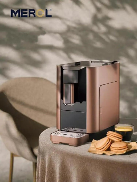 Premium Silver Espresso Coffee Machine For Your Daily Grind Compact Kitchen Drip Brewer with coffee cup and cookies.
