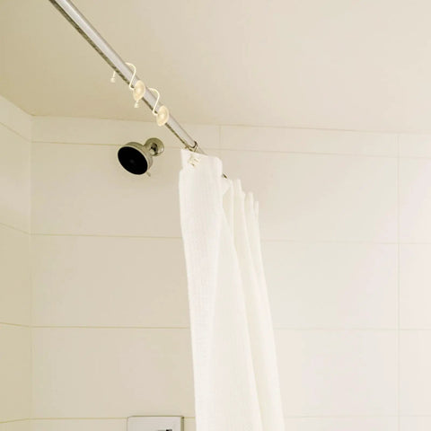 Half Round Shower Curtain Hooks 12 Pack Zinc Frosted Silver Hanging Rings glide smoothly on shower rod with white curtain.