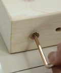 Close-up of M8 X 120mm Hex Drive Socket Cap Furniture Barrel Nuts And Bolts Set for repairing a wooden frame.