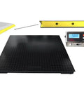 Heavy Duty Digital Floor Scale 5 X 5 Ft with LCD display, black steel deck, and yellow rubber bumper for warehouse shipping.