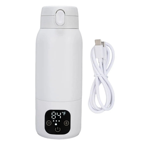 Cordless Portable Travel Electric Kettle 500ml 316 Stainless Steel With Ridiculously Fast 360 Degree USB Charging For Quick Tea Coffee Prep Grab And Go Travel Essentials next to USB charging cable.