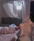 Bedroom setup with Blue Anime Neon Sign LED Tube Night Light for Wall Decor, 21x15.6 Inch above a bed and gaming chair.