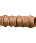 Close-up of a single barbed connector from the 20 Pack Drip Irrigation Barbed Coupling Fittings for Half Inch Tubing 17 mm Barbed Connectors Fits 0.560 to 0.600 Inch ID Easy Install Durable Garden Irrigation System Couplers.