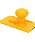 Rock Solid ABS Table Saw Push Block Engineered For Clean Safe Feeding With Ergonomic Non Slip Handle on yellow surface.