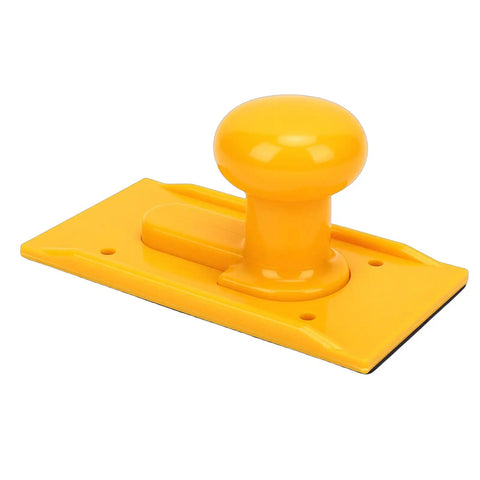 Rock Solid ABS Table Saw Push Block Engineered For Clean Safe Feeding With Ergonomic Non Slip Handle on yellow surface.